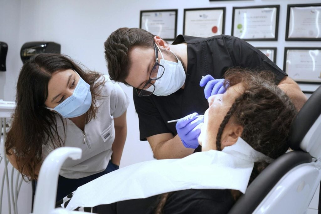 A woman and man in a dental office